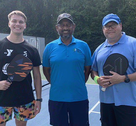 Coach Jag with pickleball players